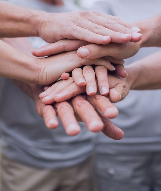 Hands stacked together in teamwork