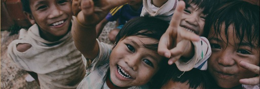 Smiling children benefiting from charity support